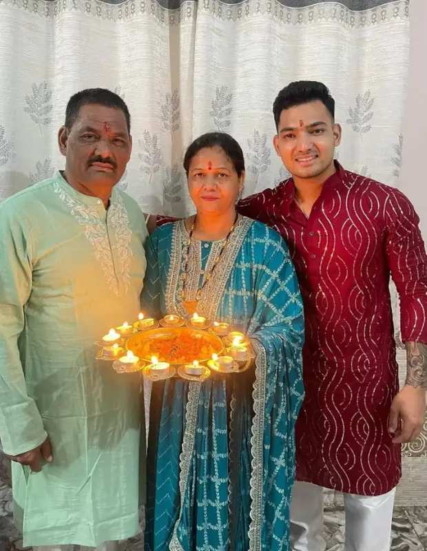 Anuj Rawat with his Parents